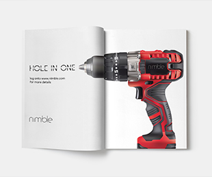 an open magazine page with a hand drill ad